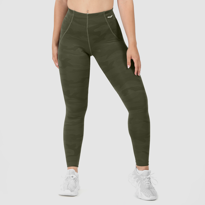 a fit  woman wearing olive
camouflage legging  with white logo, white shoes,  plus light gray background