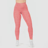 a fit woman wearing camo orange legging and shoes white ,plus the background is light grey 