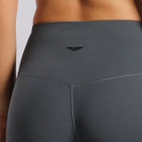close up view for back view of woman wearing legging grey with logo