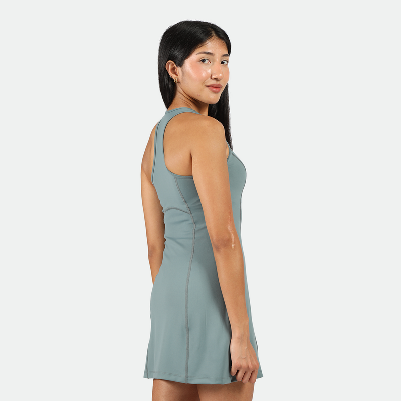 a fit woman wearing dress green 