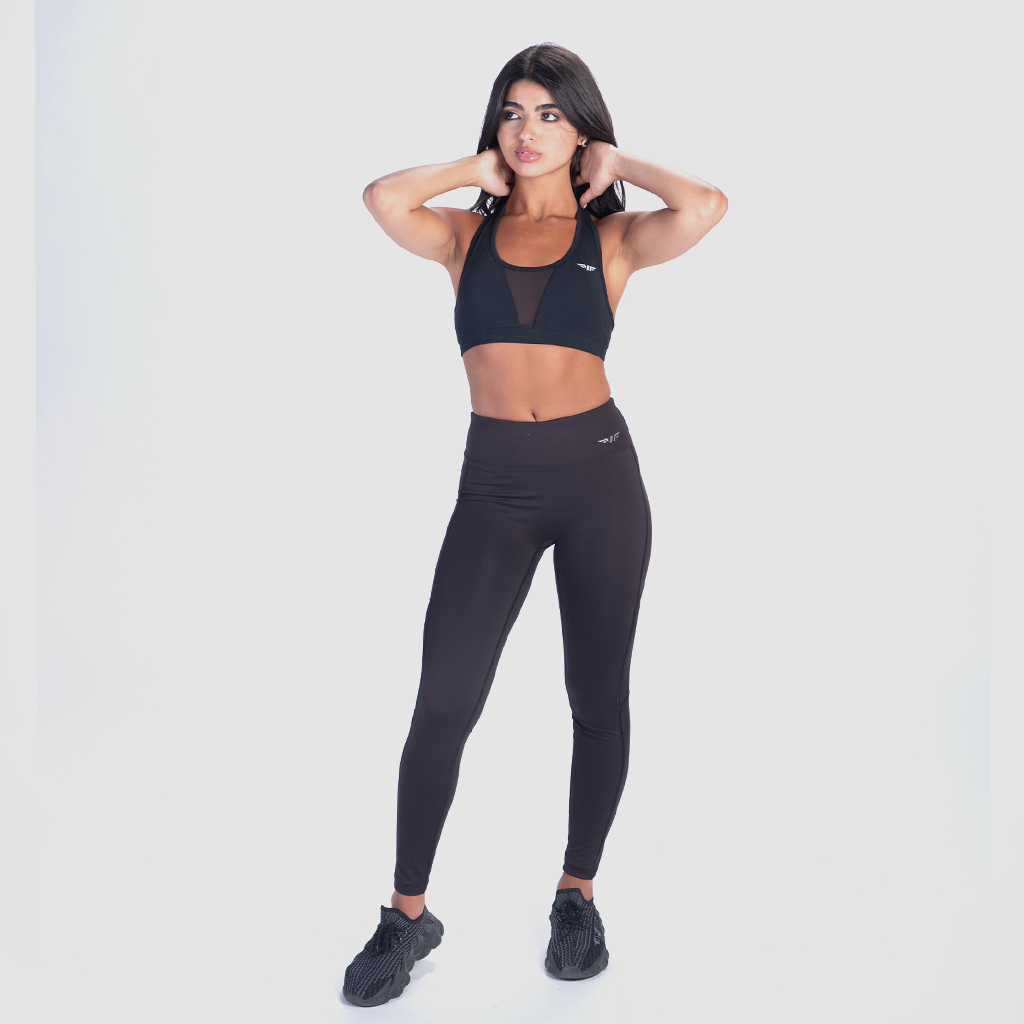 a fit woman stand with pose and legging matching set black bra and legging 