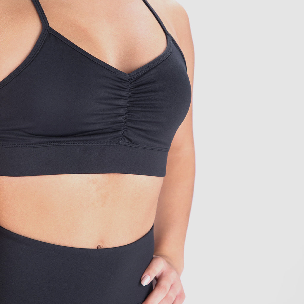 a women wearing bras and leggings black ,plus the design of bras . 