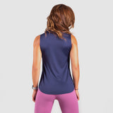 a back view for fit woman wearing tank azure blue with legging pink 