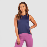 a fit woman wearing  tank Azure blue with legging pink