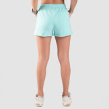 a back view for fit woman  wearing sky blue short with shoes ,plus the background is light grey 