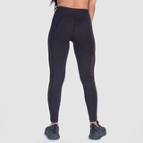 a back view for fit woman wearing  legging black  with sneakers black 