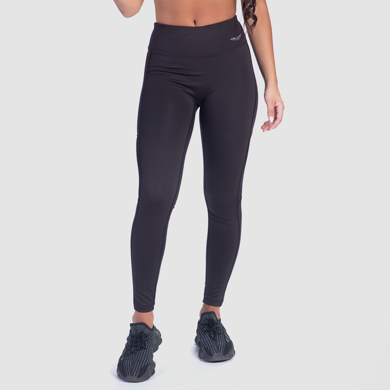 a fit woman wearing legging black with logo  and sneakers 