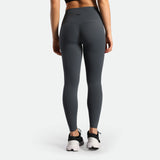 a back view for woman wearing legging grey with shoes black 