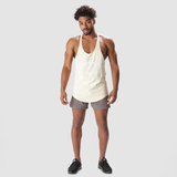 a fit man wearing tank afterglow with logo and short grey ,plus shoes black 