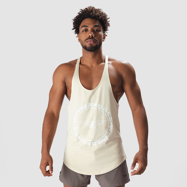 a fit man wearing tank  afterglow beige with short grey 