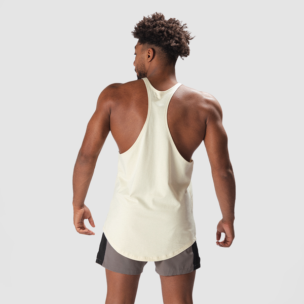 a back view for fit man wearing tank   afterglow beige with short grey 