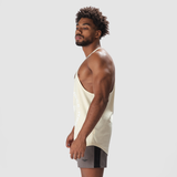 a fit man wearing tank afterglow with short grey 