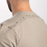 close up view for back view of man wearing t-shirt agate grey with logo 