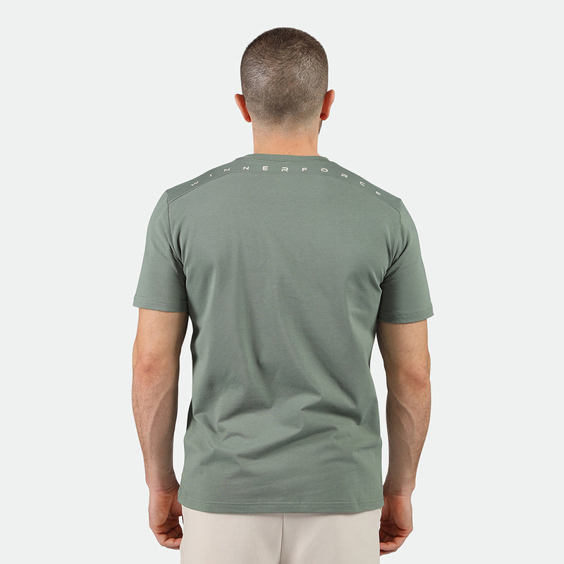 a back view for fit man wearing t-shirt agave green and pants beige 