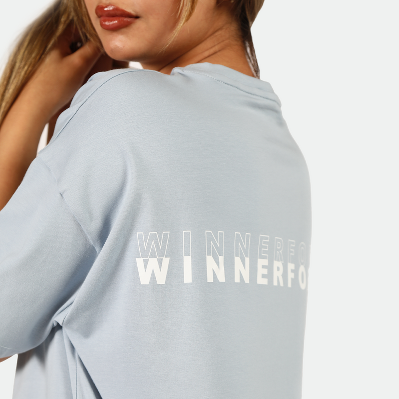 close up view for fit woman wearing t-shirt blue with logo 