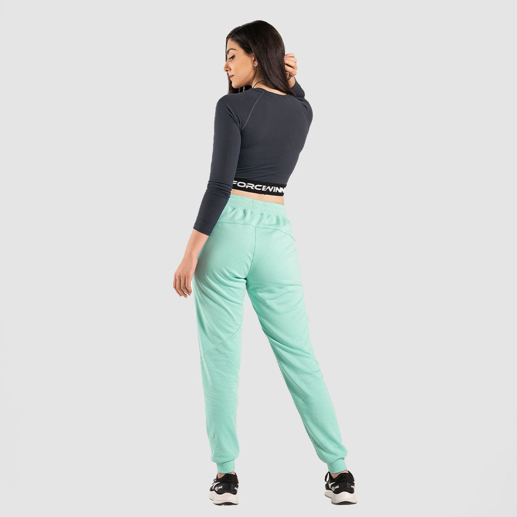 a back view for fit woman wearing crop top black with pants aqua  and sneakers  black 