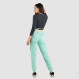 a back view for fit woman wearing crop top black with pants aqua  and sneakers  black 