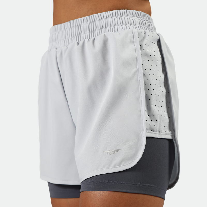 close up view for fit woman wearing 
 arctic ice blue short  ,plus the background is light grey 