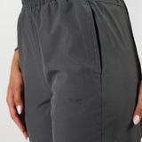close up view for pocket of pant with logo ,plus the background is light grey 