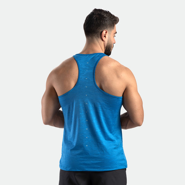 a back view for fit man wearing  camo tank azure blue with pants black 