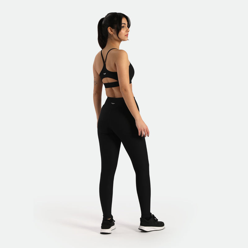 a back view for women wearing  matching bras sports  and leggings with same logo