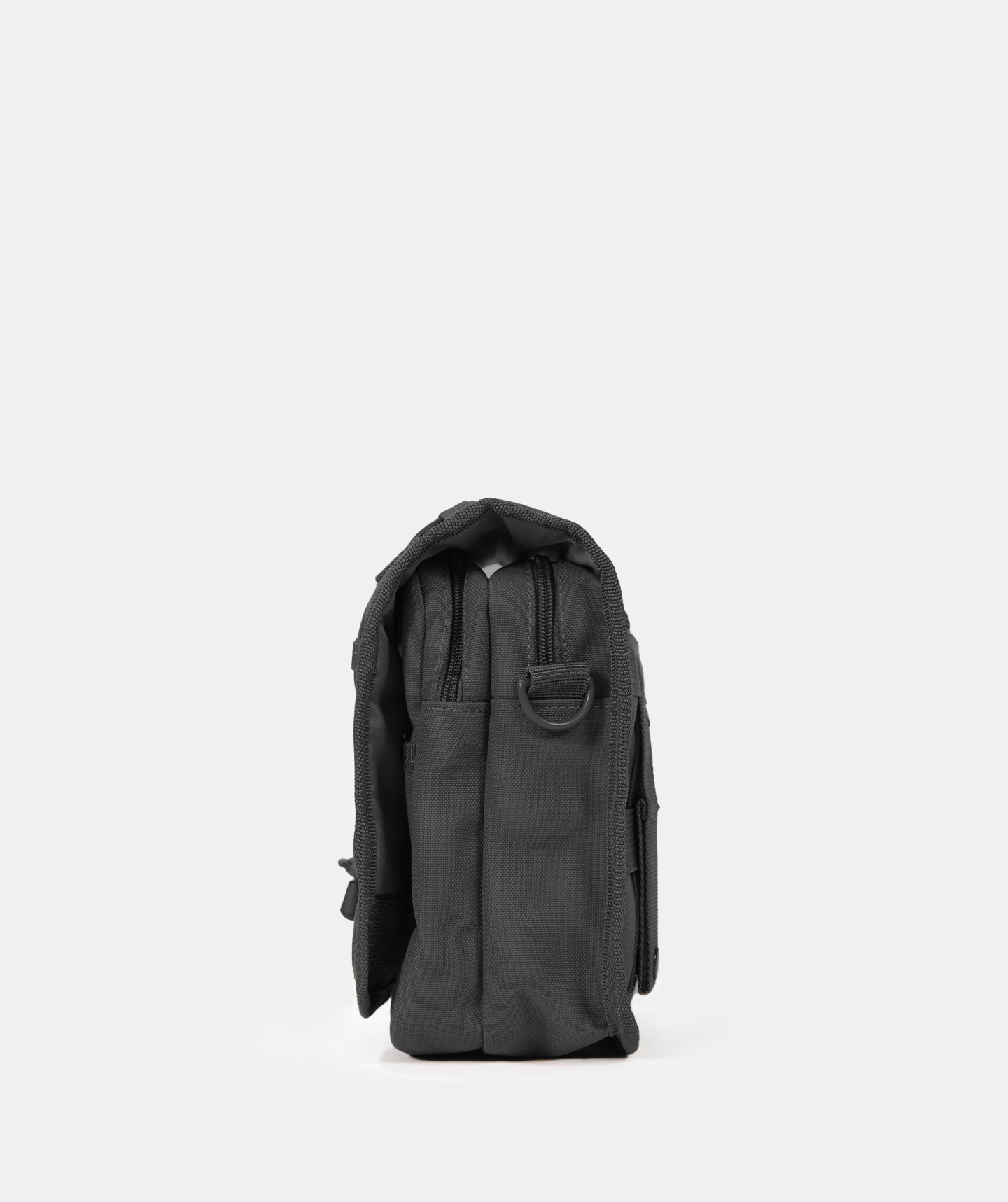 side for A small, black crossbody shoulder bag with an adjustable strap