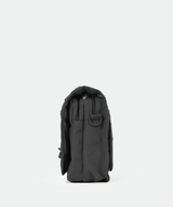 side for A small, black crossbody shoulder bag with an adjustable strap
