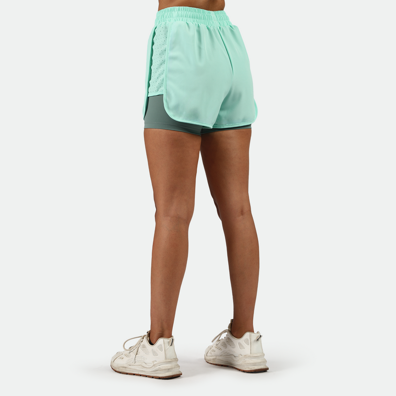 a back view for fit woman wearing  beach glass blue with shoes white ,plus the background is light grey 