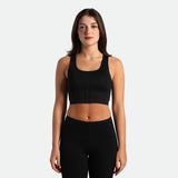 a fit woman wearing matching set black ,bra and legging 