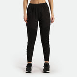 a fit woman wearing pants black with sneakers black 