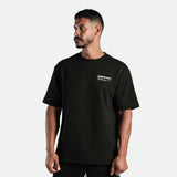 a fit man stand at right and wearing  matching set black  t-shirt black with logo and short black 