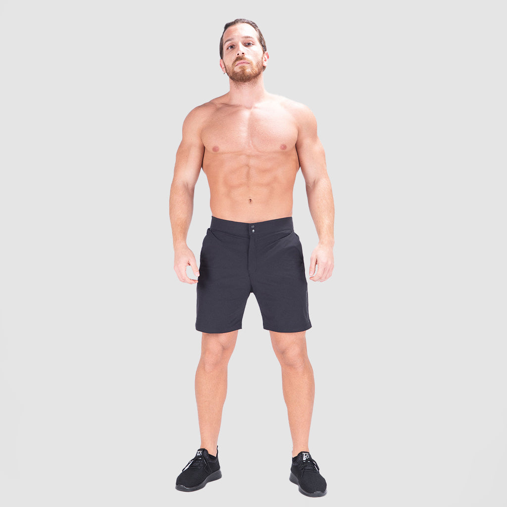 a fit man wearing short black with shoes black 