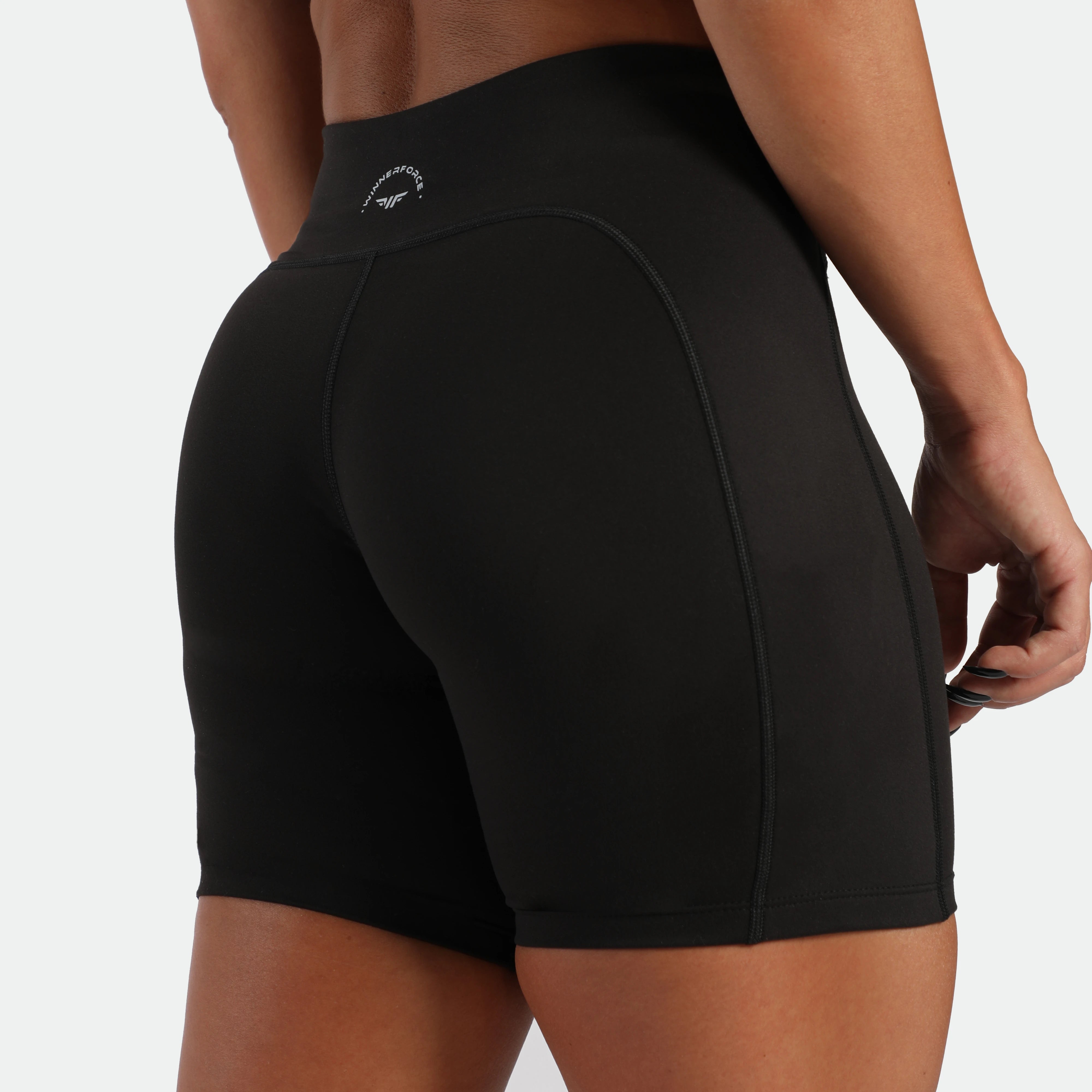 close up view for back view of woman wearing short black 