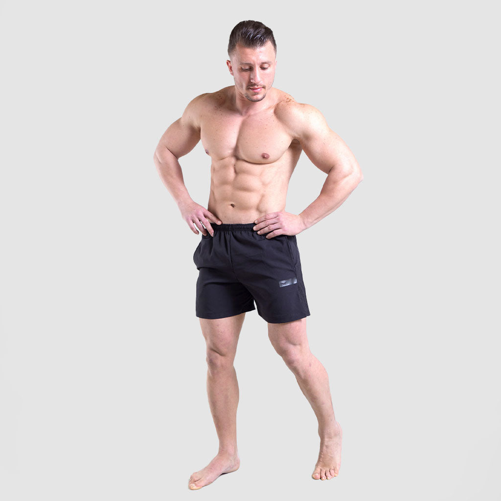 a man wearing short vimaxo black