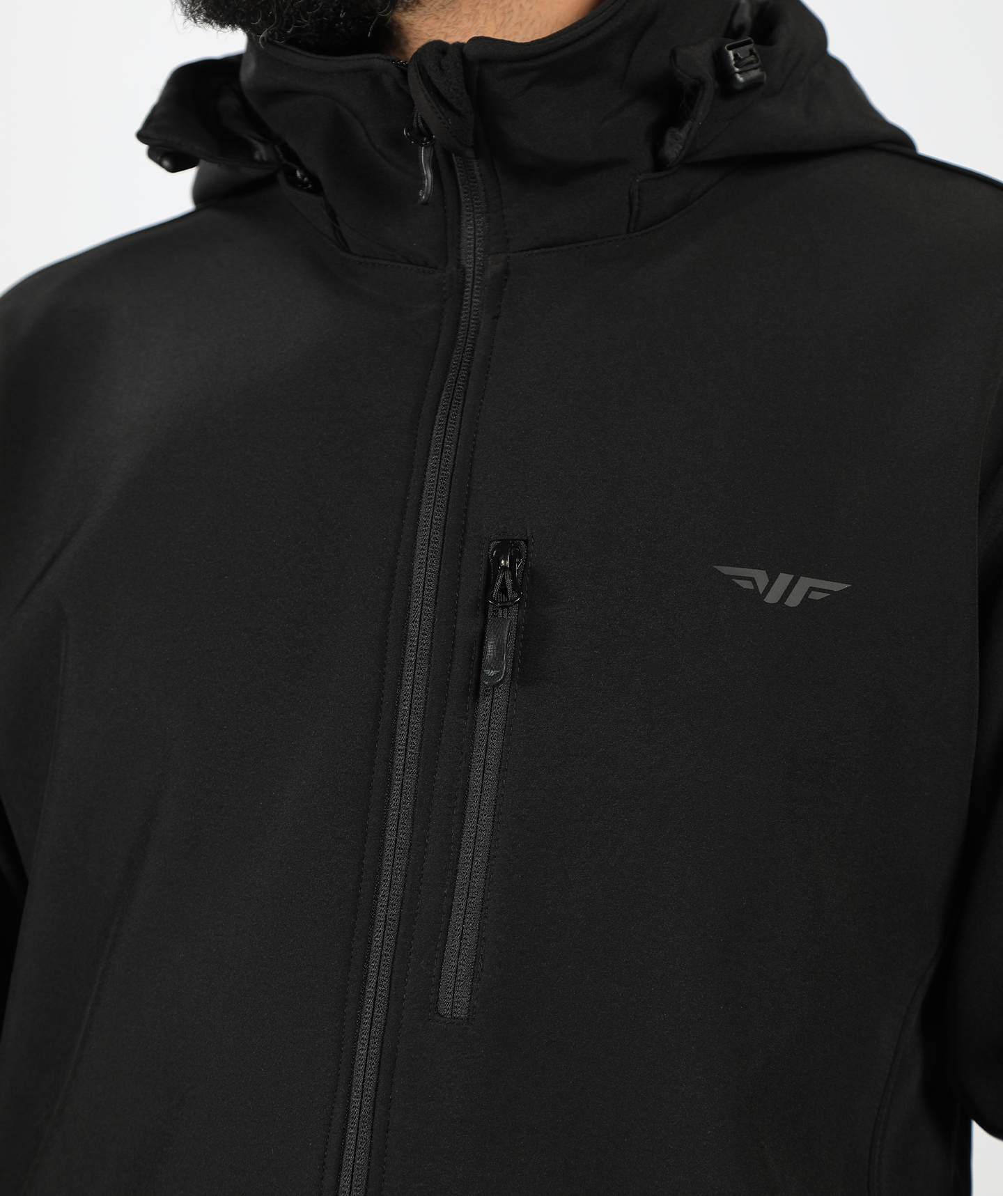 A close-up of a person's wearing aoplo black with zipper and logo 