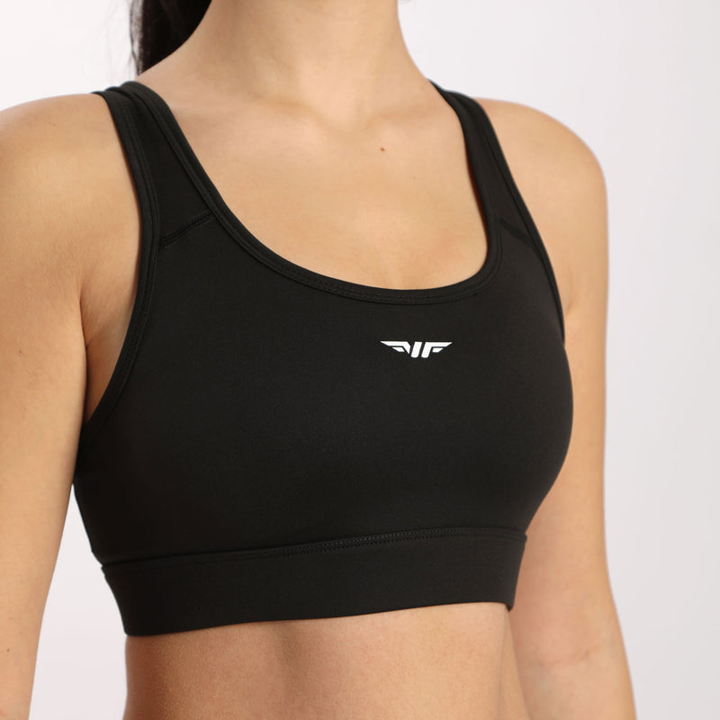 Little girl wearing black bra with white logo (winnerforce), logo in the middle