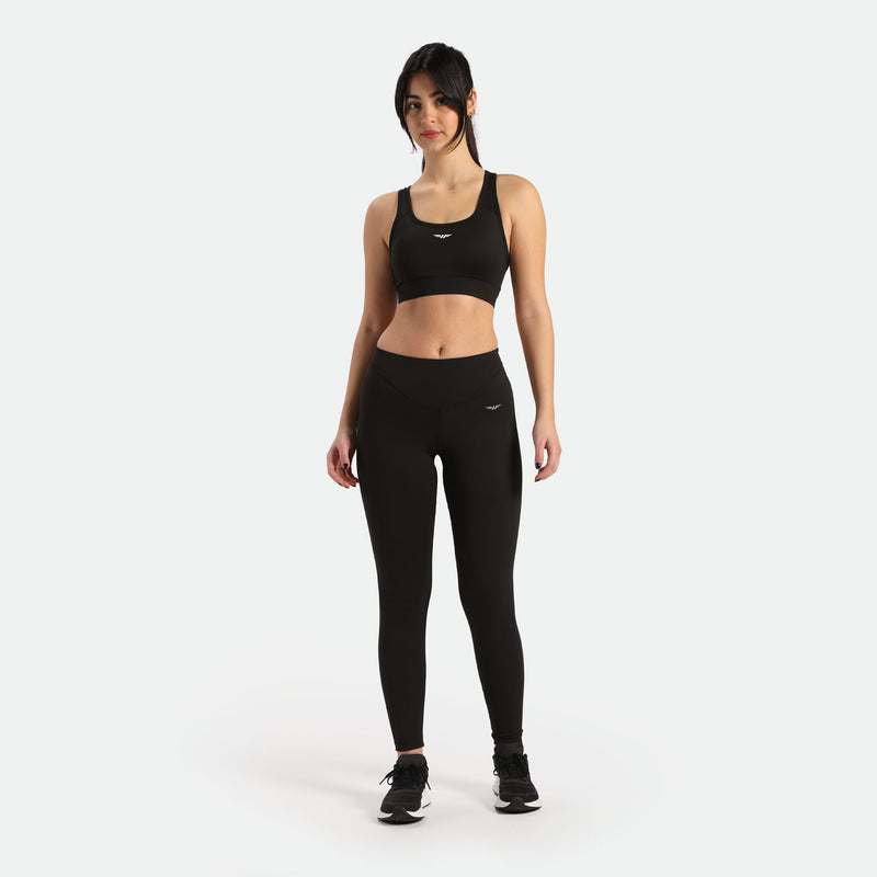 a women wearing matching bras and leggings black ,have same logo,but the direction  is different.
