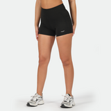 a fit woman wearing short  black with logo ,she wearing shoes ,plus the background is light grey 