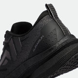 Close-up of a black athletic shoe with a sleek, textured design. The word "Aurarun" is visible on the side, conveying a modern, sporty style.
