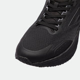 Close-up of a black athletic shoes, showcasing the textured fabric, sleek design, and intricate lacing. The shoes exudes a modern, sporty feel.
