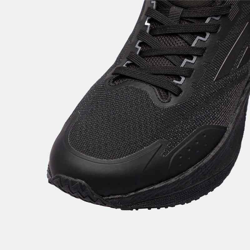 Close-up of a black athletic shoes, showcasing the textured fabric, sleek design, and intricate lacing. The shoes exudes a modern, sporty feel.