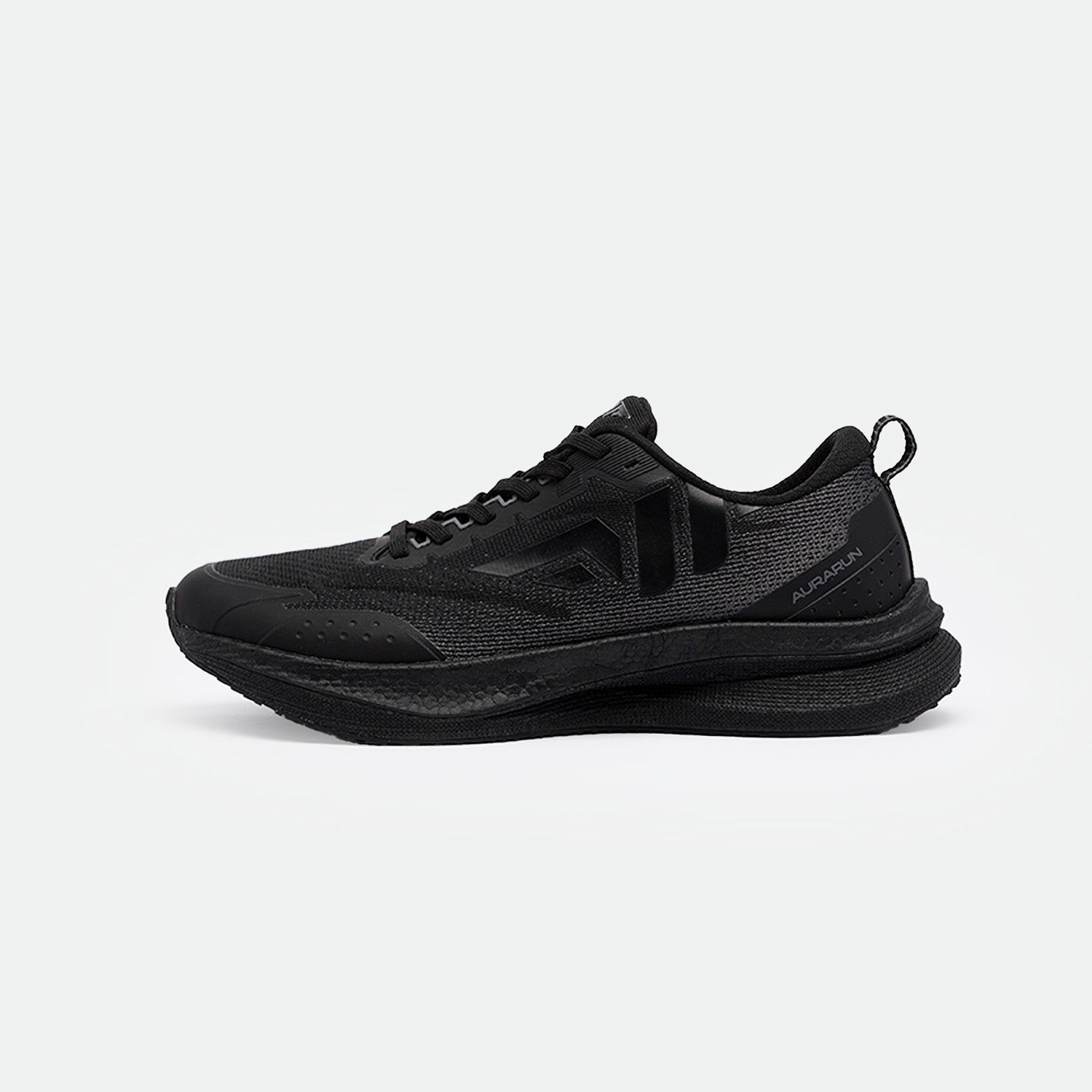 Sleek black running shoes with textured mesh and rubber sole. Features subtle logo and lace-up design, conveying a modern, sporty aesthetic.
