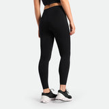 a back view for fit woman wearing legging  black with shoes black 