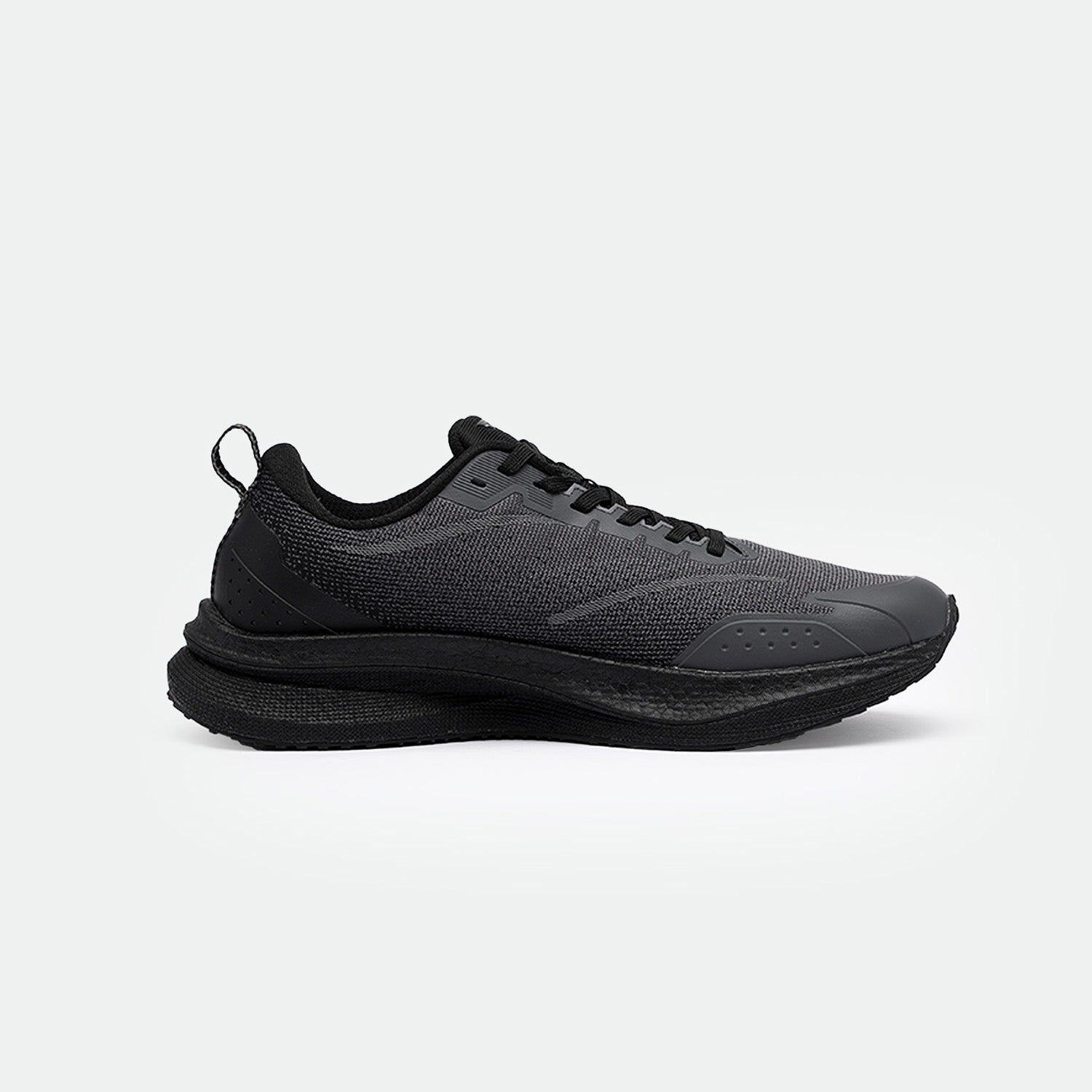 Sleek black running shoes with mesh fabric and perforated details. The shoes features a thick sole for comfort and a minimalist design, set against a plain background