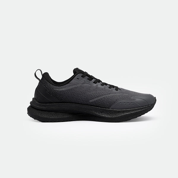 Sleek black running shoes with mesh fabric and perforated details. The shoes features a thick sole for comfort and a minimalist design, set against a plain background