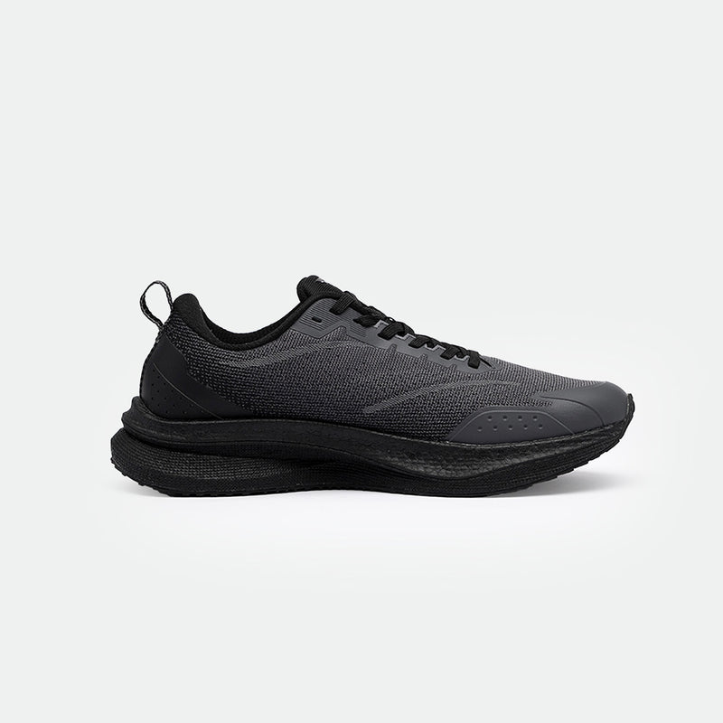 Sleek black running shoes with mesh fabric and perforated details. The shoes features a thick sole for comfort and a minimalist design, set against a plain background