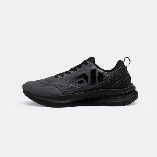 Sleek black athletic shoes with textured mesh, featuring a prominent heel loop and curved sole. Modern design exudes a sense of power and agility.