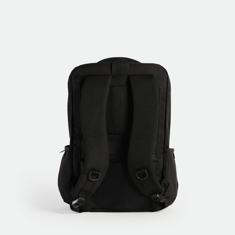 Back view of a black backpack featuring two adjustable padded shoulder straps, a padded back panel with breathable mesh, and a sturdy top handle