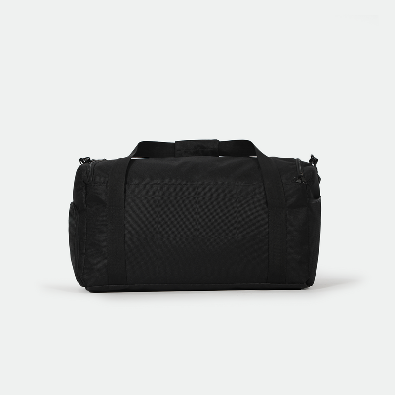 A black duffel bag with sturdy handles and a textured surface is centered against a plain white background, conveying simplicity and functionality.