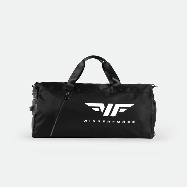 A black  duffel bag with two handles and a shoulder strap, featuring a white WINNERFORCE logo and stylized wings design on the front. The bag has a front zipper pocket against a plain white background.